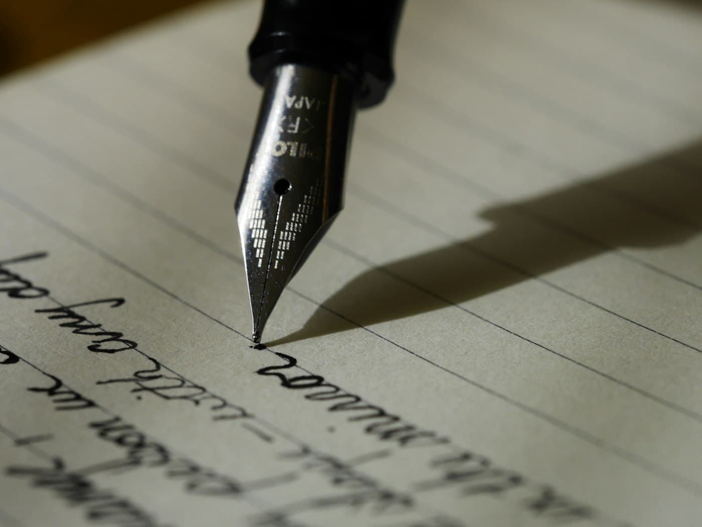 Fountain pen on a handwritten page